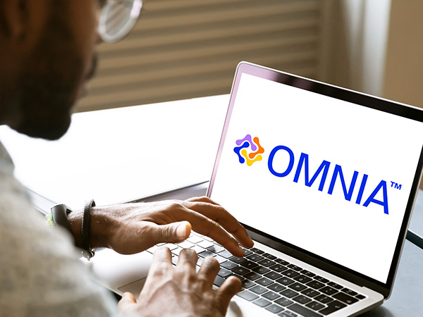 A computer showing the OMNIA™ logo